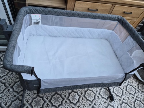 Puggle baby bassinet next to - puggle,